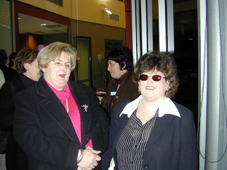 Guests enjoying the celebration in the corridor