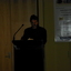 Narrator Stig Wemyss at the podium