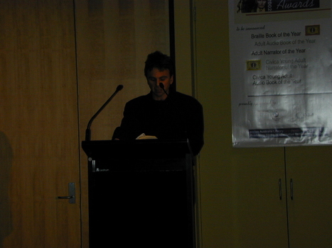 Narrator Stig Wemyss at the podium