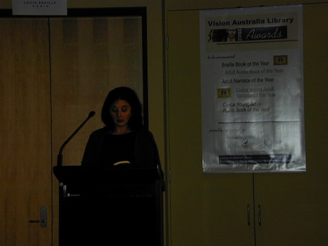 Narrator Melissa Eccleston at the podium
