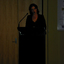 Narrator Rebecca Macauley at the podium