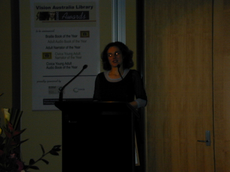 Either the winning author, or the author’s representative, accepting the award