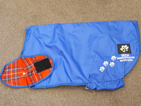 Blue polyster dog coat with fleece tartan lining