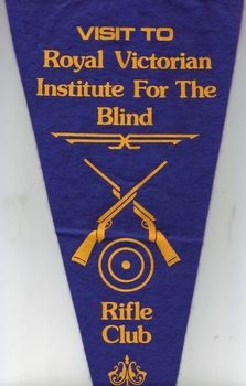 Blue and gold felt pennant with crossed rifles and 'Visit to Royal Victorian Institute for the Blind Rifle Club'