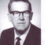 Portrait of George Glover in suit and tie