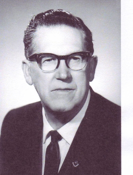 Portrait of George Glover in suit and tie