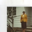 Photograph of Grace Hoppitt outside a house in her Australian uniform