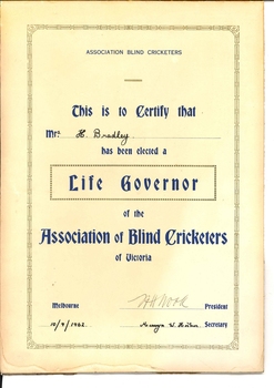 Certificate with gold edging, blue writing and black handwriting