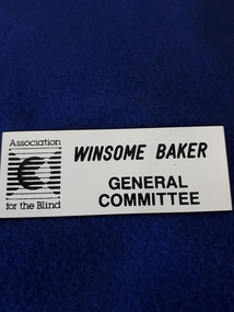 Name badge with black writing on white background and AFB logo