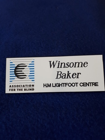Name badge with black writing on white background and AFB logo