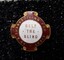 Red and white badge with gold edging