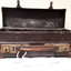 Battered small brown suitcase with rusted locks