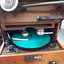 Leather covered box with flip top and turntable with two heads for inscribing and reading, metal speaking tube and various knobs and levers