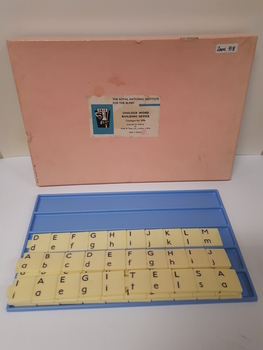 60 plastic tiles with large print and braille markings that sit inside blue plastic tray