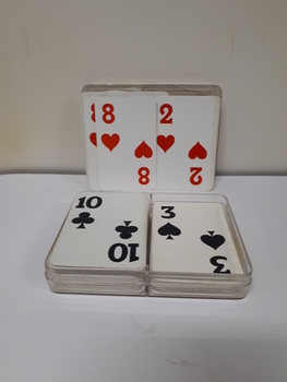 UNO playing cards with braille embossed on top left-hand and bottom right-hand corners in red cardboard box