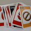 UNO playing cards with braille embossed on top left-hand and bottom right-hand corners.