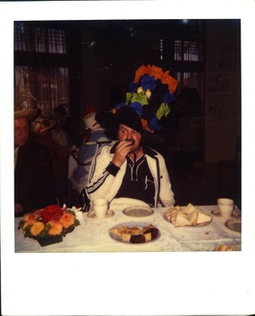 Mr Joe Dean (tall orange and blue and green hat)