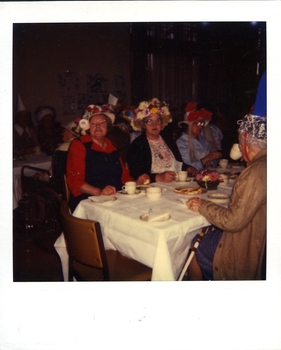 Mrs Bennett (blue pinafore) and Mrs Joan Perry (white, yellow, pink flowers)
