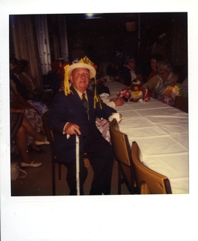 Mr Norm Batten (sun hat with yellow streamers)