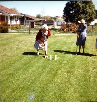 Two women playing croquet at Kelaston