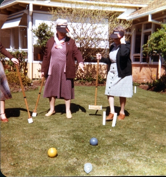 Two woman playing croquet at Kelaston