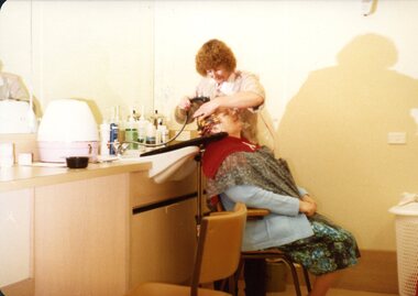 Woman getting her hair washed