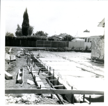 Laying out of concrete base for building extension