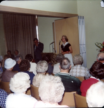Lilian Dethridge speaking at microphone