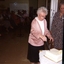 Mrs Hamill cutting the anniversary cake