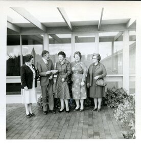 3 Women present a cheque to a man and Matron