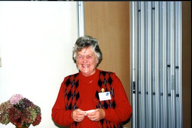 Edna Allen smiling at camera at her presentation