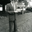 Roy King holds a plaque outside Kelaston