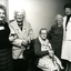 Three residents with two staff members at the retirement party for Mrs Hay
