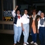 Four woman pose for the camera dressed in casual clothing