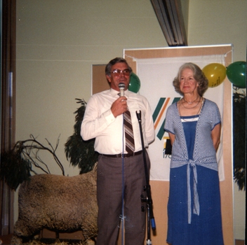 Don Dunstan talking into a microphone with Lillian Dethridge beside him