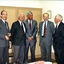 Six men in suits during a business presentation for the Kelaston appeal