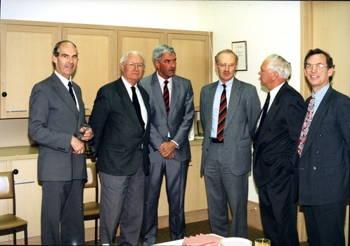 Six men in suits during a business presentation for the Kelaston appeal