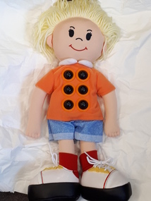 Soft doll with Braille dots on chest