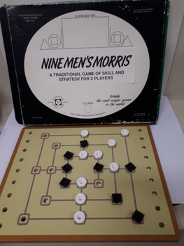 Wooden board in green/black box with plastic tags