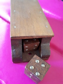 3 wooden dice in a wooden box