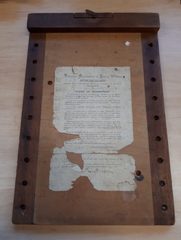 Wooden Braille board with Rules of Membership for VABW attached to board