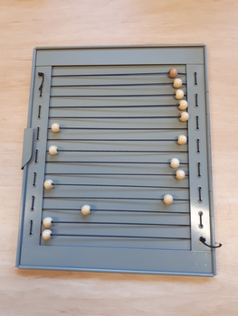 Metal frame with elastic and beads inset