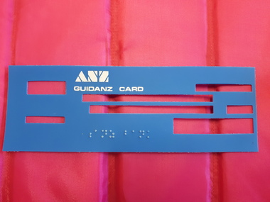 Blue card with windows for writing and braille label