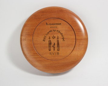 Wooden round with with Qantas presents RVIB Carols by Candlelight inscribed