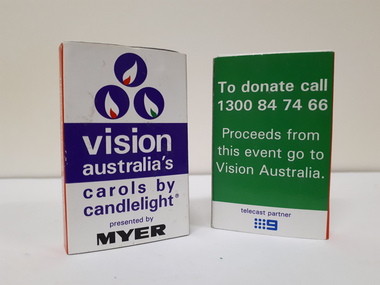 Front and rear view of match box with purple and white writing, against white and purple (front) and green and white (back) backgrounds