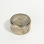 Small round silver tin with inscription on lid and tea candle inside