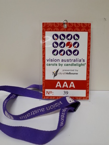 Red card with Carols logo, AAA and number 39 on purple Vision Australia lanyard