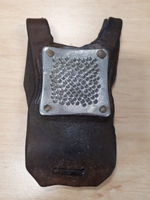 Palm sized leather harness with metal square