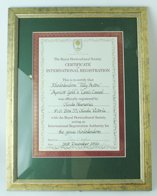 Black handwriting on white paper with maroon and gold decoration