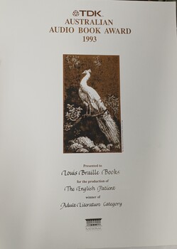 White paper with black and brown writing and illustration of peacock